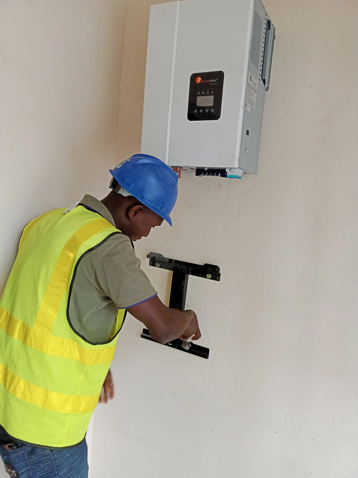 YTECH Senior Electrical Engineer testing solar power control panel